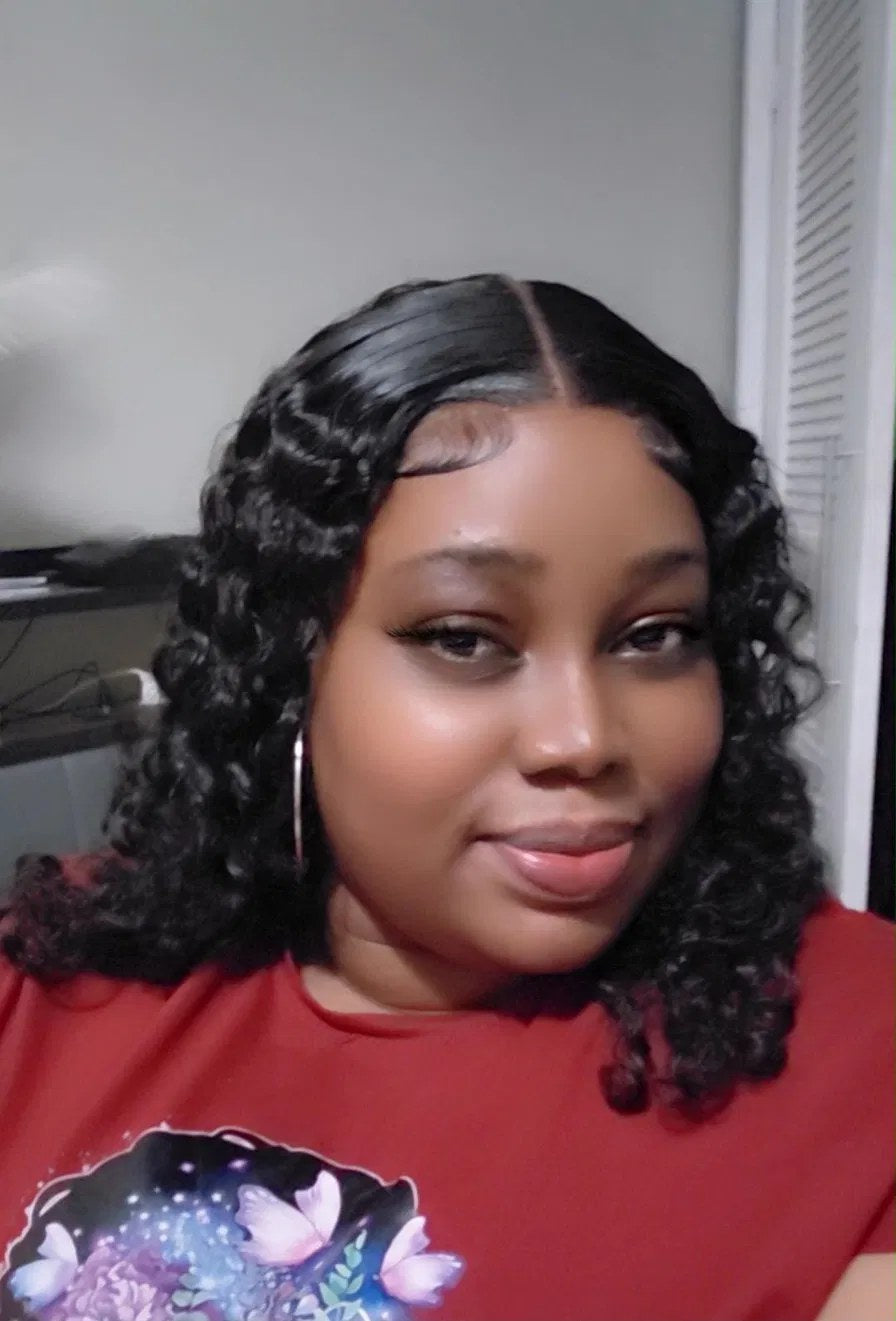 Curly middle-part wig on Dynasty Hair Company client Jada K.